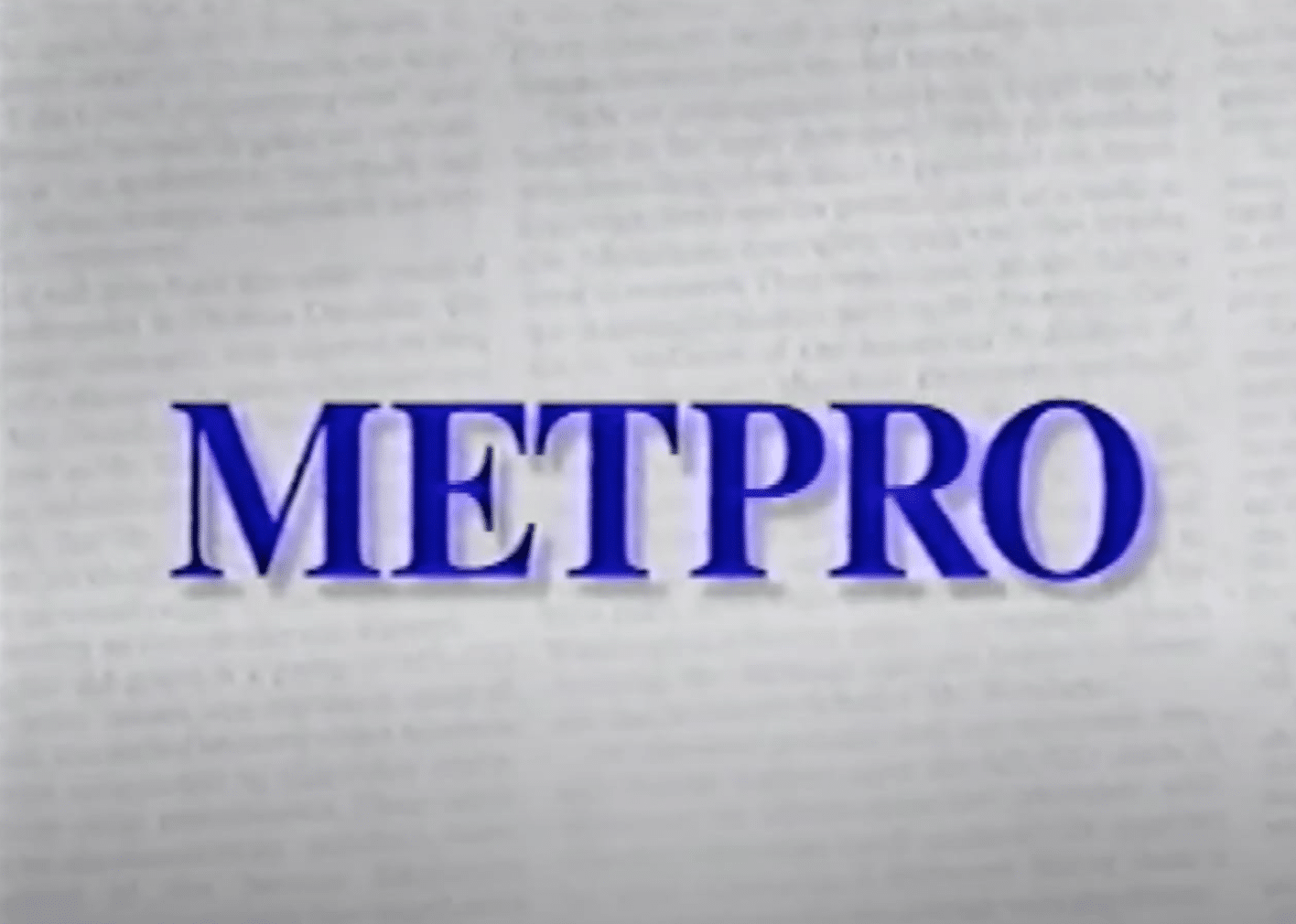 Metpro in all-caps in purple letters on a faded newspaper background.