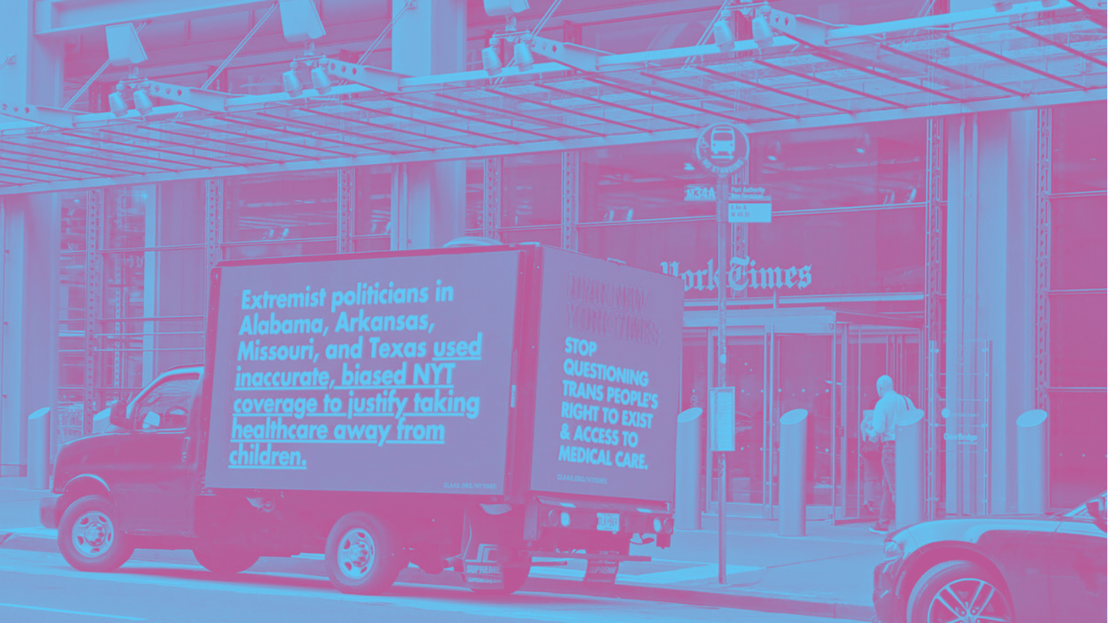 A GLAAD digital billboard next to the New York Times building in July 2024; the photo has been rendered in duotone blue and dark pink. The billboard, on the side of a truck, says: Extremist politicians in Alabama, Arkansas, Missouri, and Texas used inaccurate, biased NYT coverage to justify taking healthcare away from children. Another side of the billboard says: Stop questioning trans people's right to exist & access to medical care.